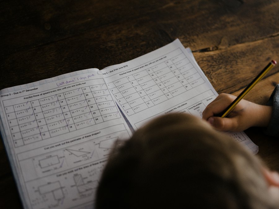 Student working through a maths worksheet